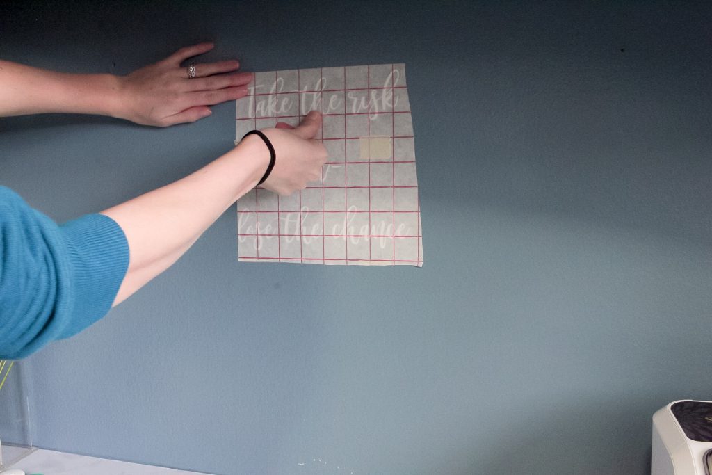 With all of your letters transferred onto the transfer paper (and reading&nbsp;backward), center your DIY vinyl letters onto your wall (or wherever else you are placing them).
